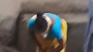 Telugu aunty in yellow saree bent and sweeping